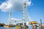 A westbound UP train crosses the Neches River Lift Bridge